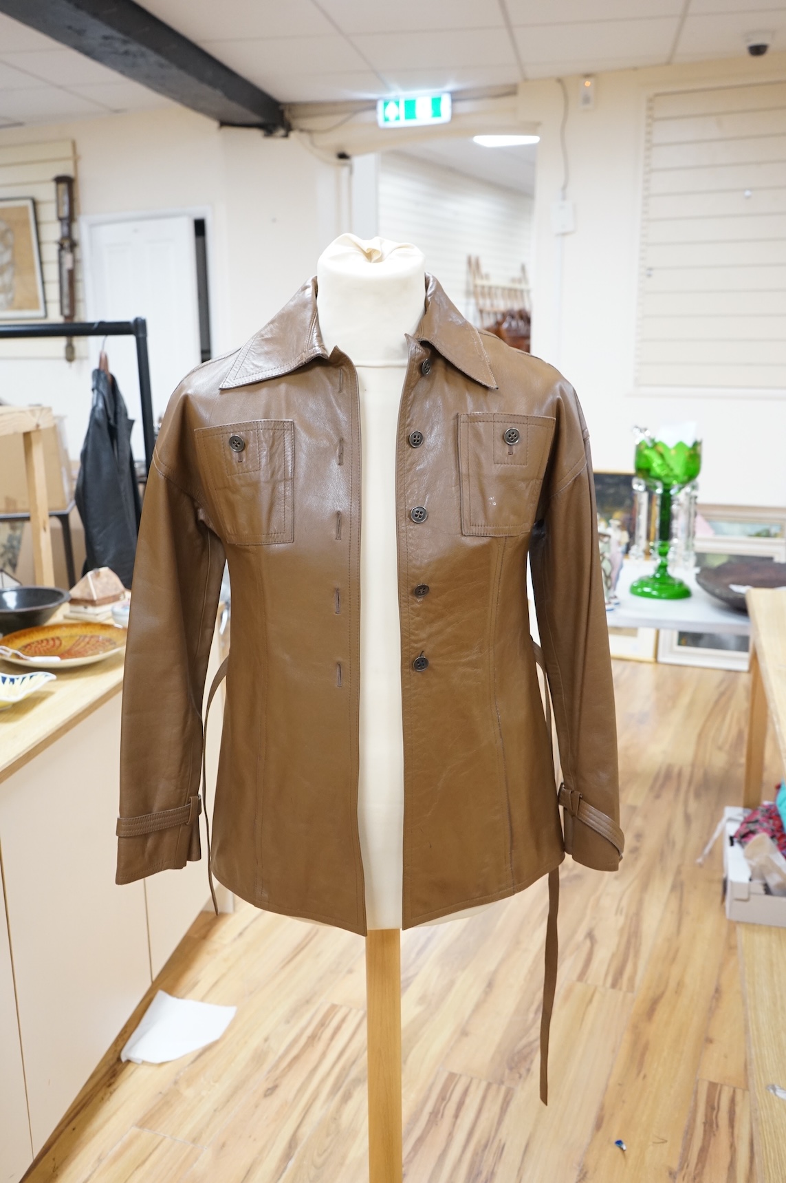 A Baccarat tan leather jacket and a black close-fitting Korean leather jacket size 10